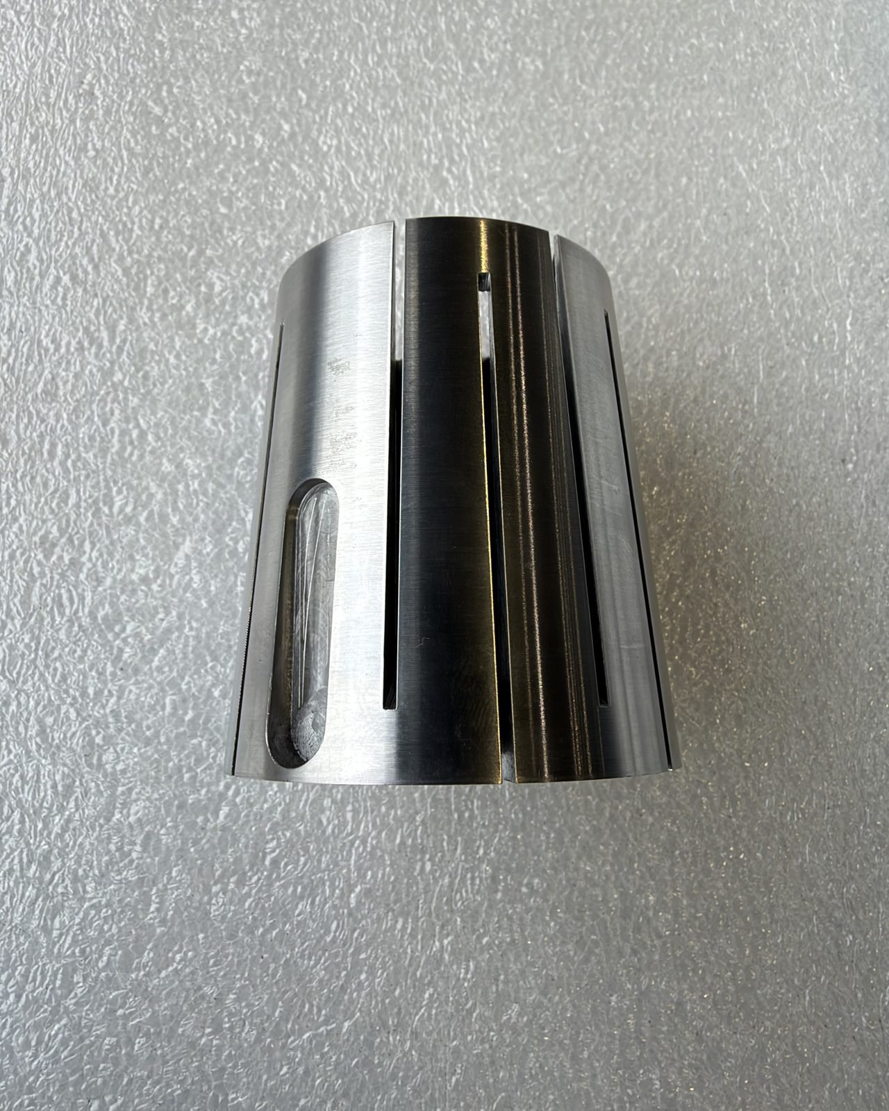 Precision machined spring collet with tapered slotted fingers