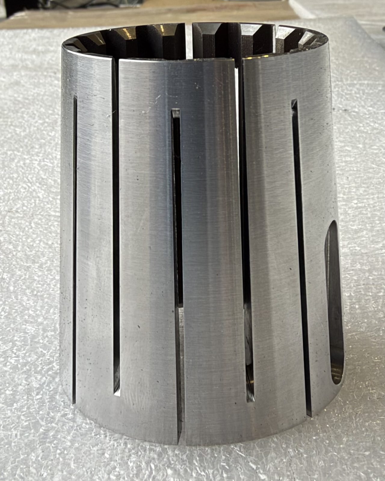 Slotted cylindrical collet sleeve, precision machined